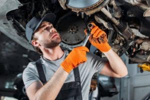 a person is repairing the car