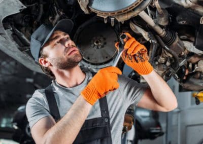 a person is repairing the car