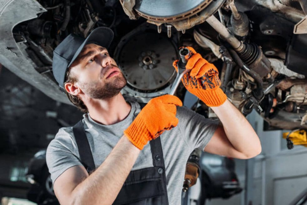 a mechanic working at an auto repair center